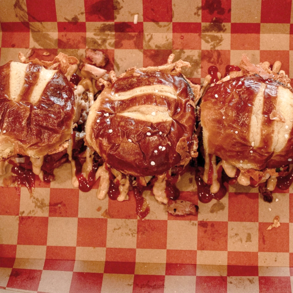Pretzel bun barbecue sliders with crispy grilled cheese and smoked meat